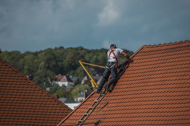 roofer standing on the roof replacing over existing