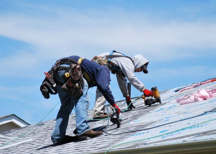 contractors working on plastic roofing in Rhode Island
