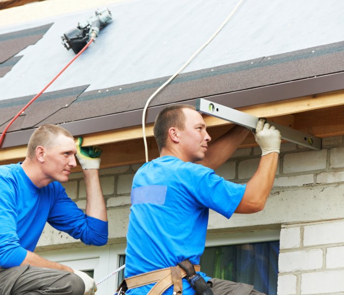 RI roof repair - two contractors repairing a roof
